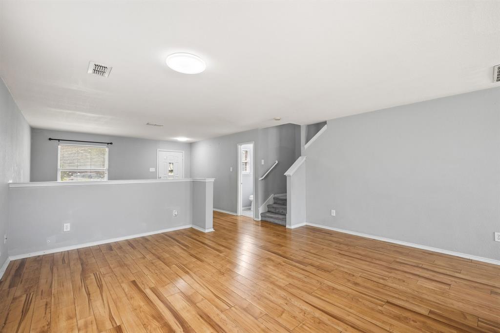 601 Amy Way Euless, TX 76039 - Photo 12 of 40 a view of empty room with wooden floor