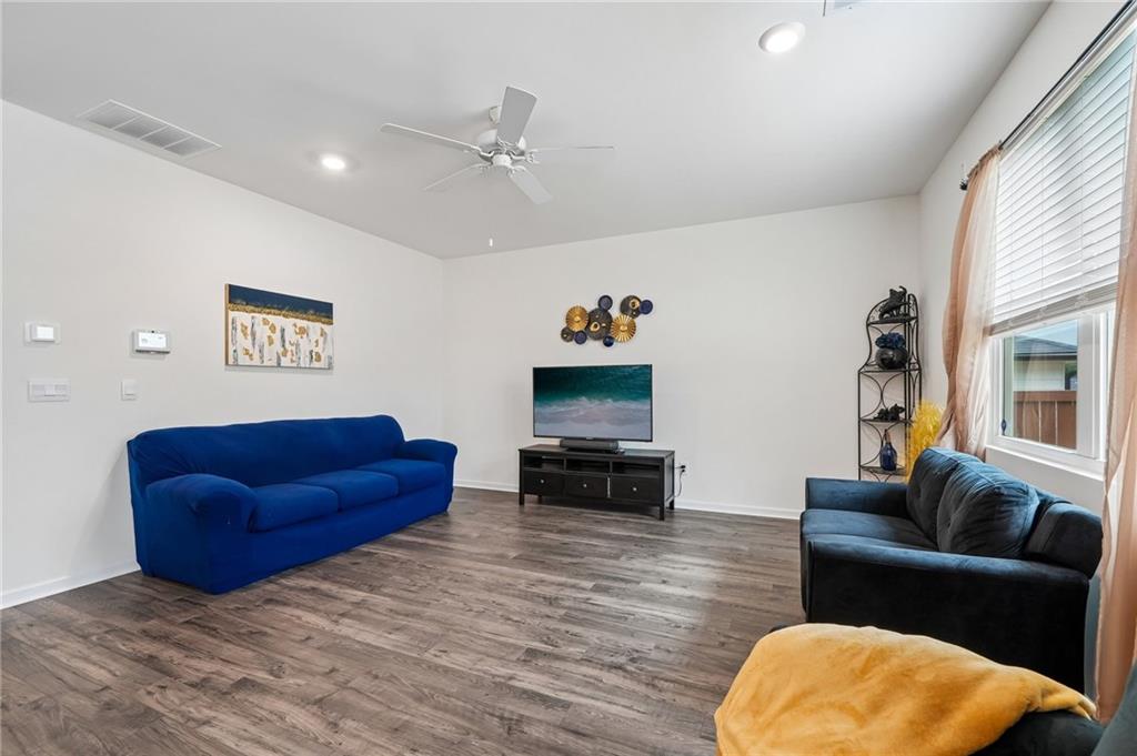 8592 Seabiscuit Road Lithonia, GA 30058 - Photo 3 of 25 a living room with furniture and a flat screen tv