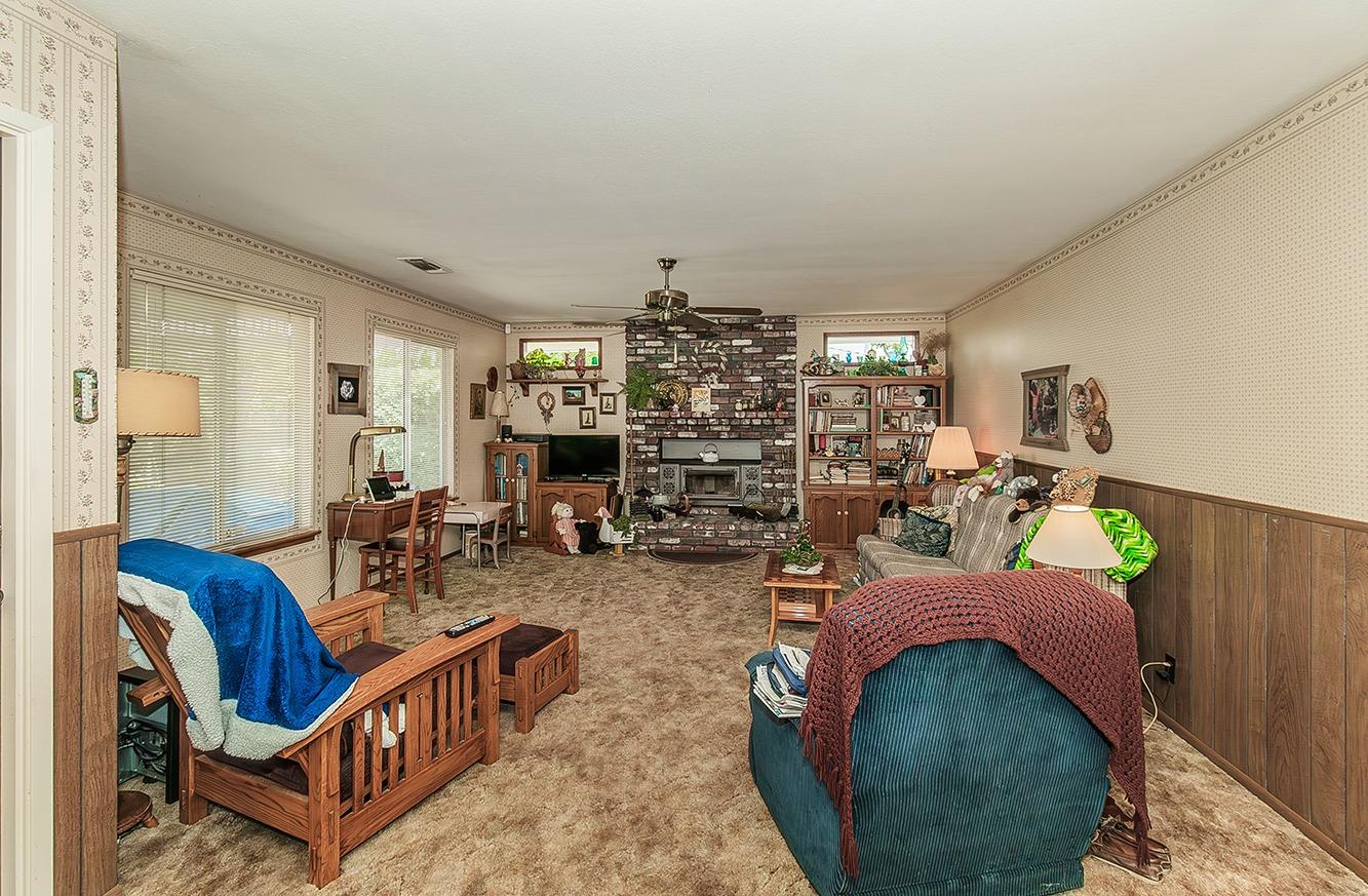 596 West Herbert Avenue Reedley, CA 93654 - Photo 15 of 30 a view of a livingroom with furniture and a rug