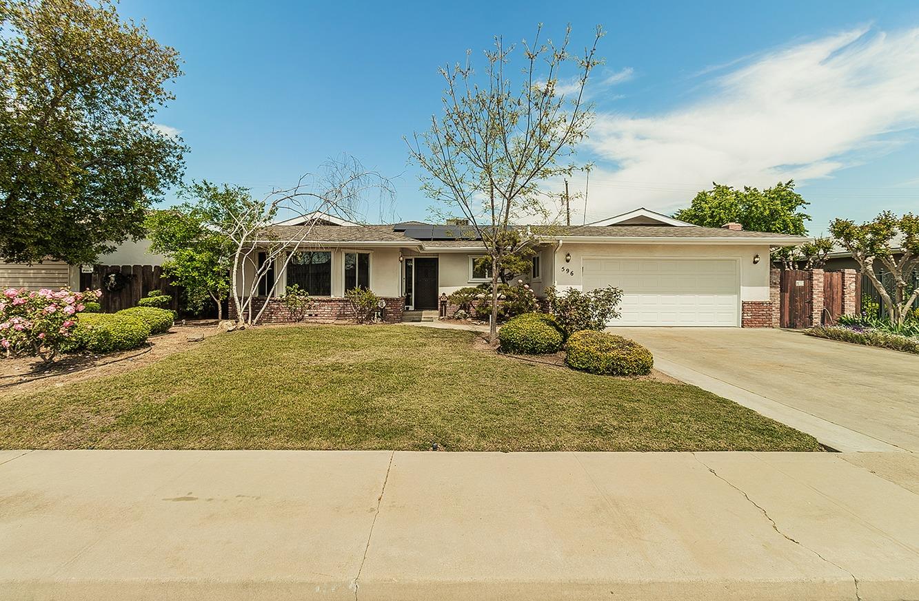 596 West Herbert Avenue Reedley, CA 93654 - Photo 2 of 30 a front view of a house with garden