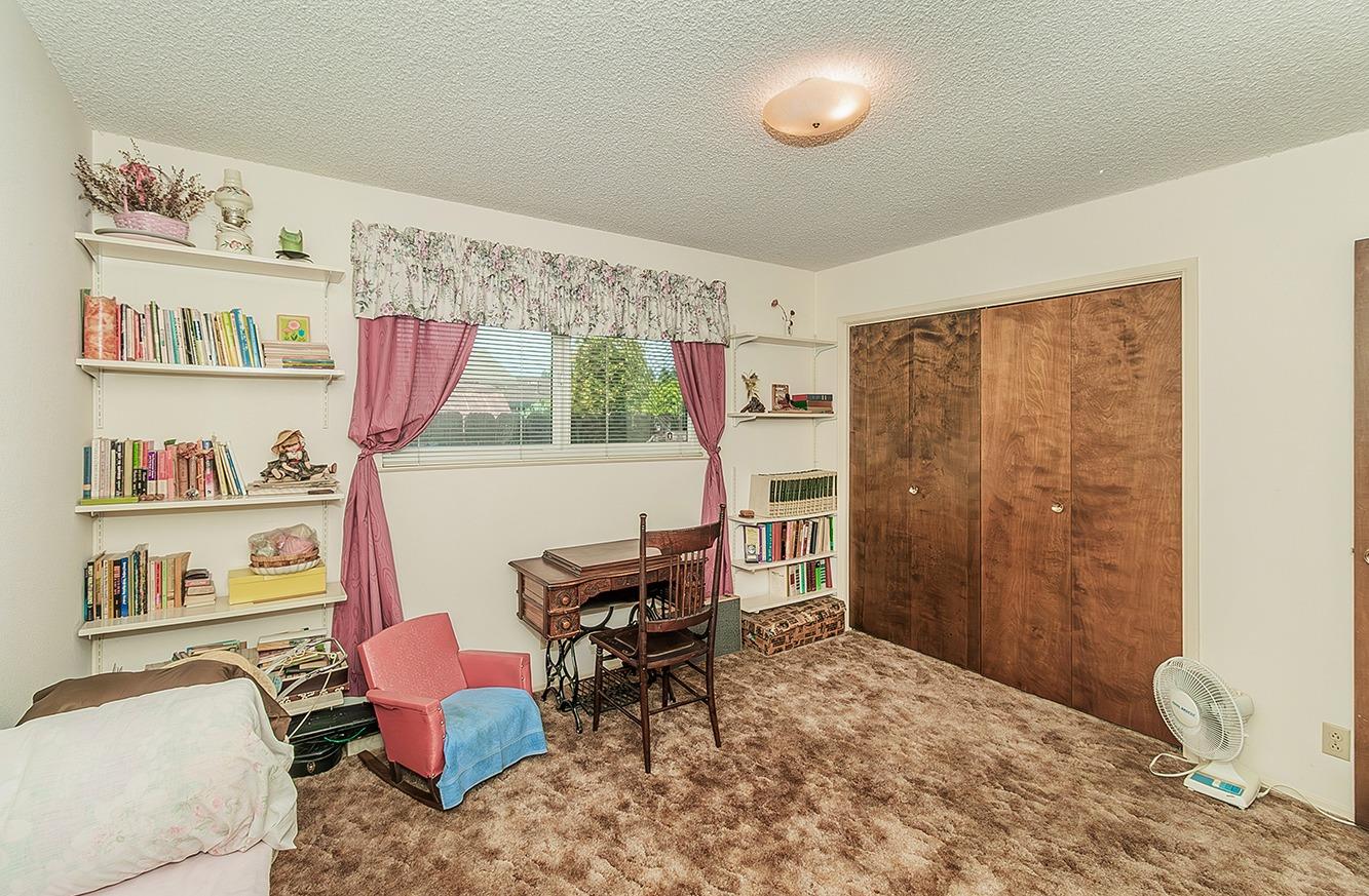 596 West Herbert Avenue Reedley, CA 93654 - Photo 23 of 30 a bedroom with furniture and a bed