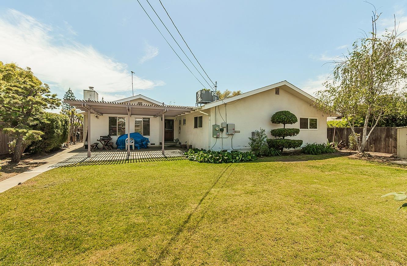 596 West Herbert Avenue Reedley, CA 93654 - Photo 30 of 30 a view of a white house with a swimming pool