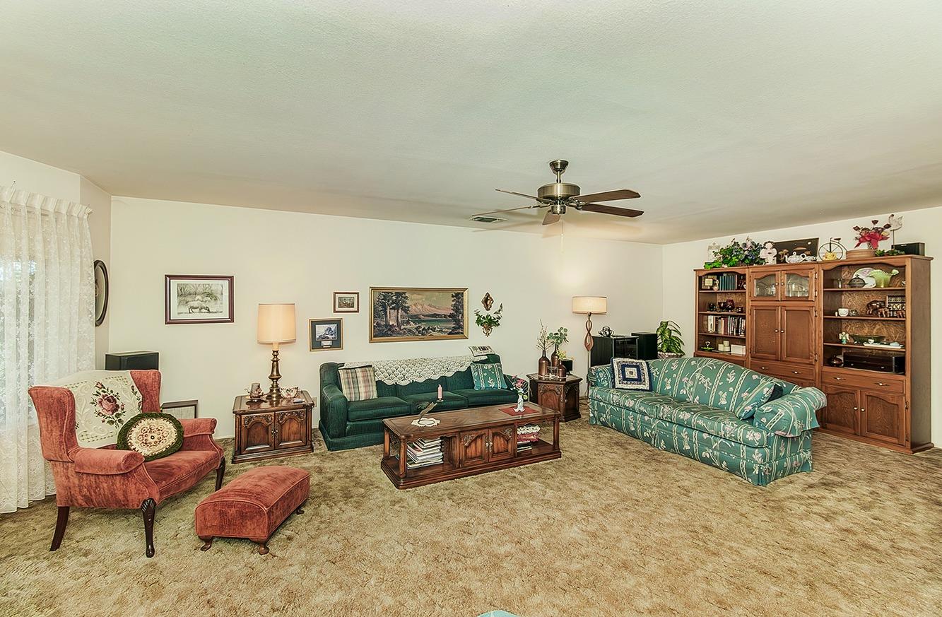 596 West Herbert Avenue Reedley, CA 93654 - Photo 5 of 30 a living room with furniture and a couch