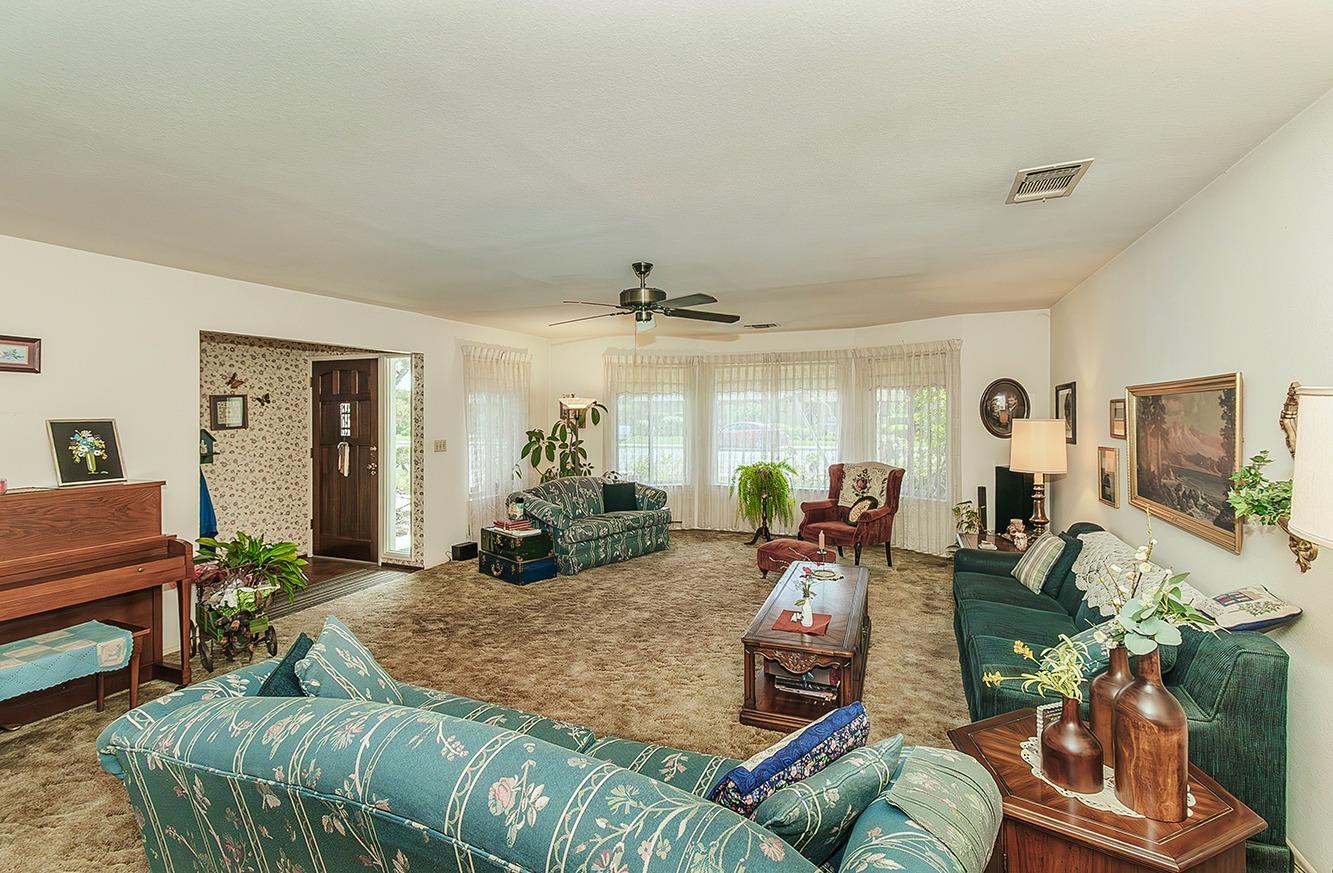 596 West Herbert Avenue Reedley, CA 93654 - Photo 8 of 30 a living room with furniture and wooden floor