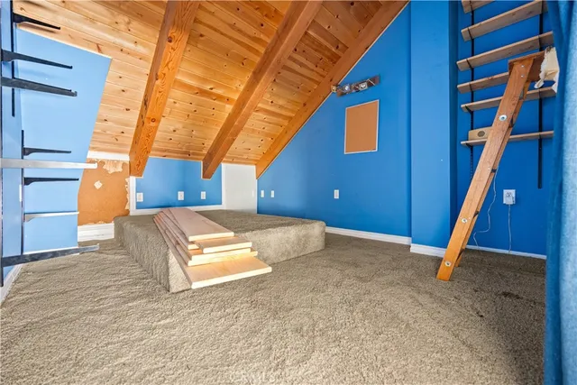 a view of a room with wooden floor and stairs