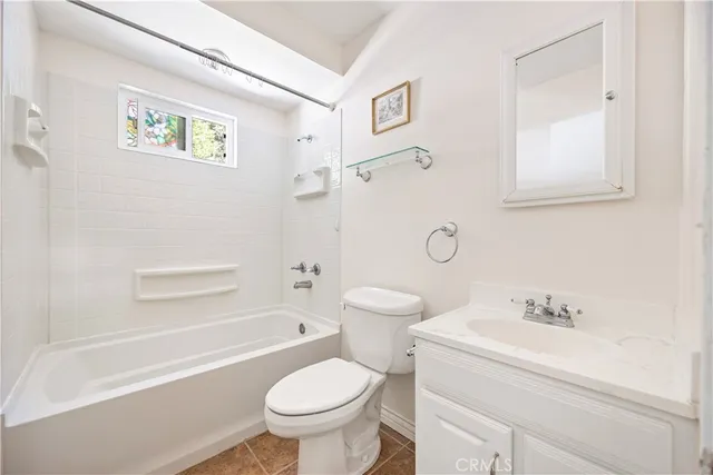 a bathroom with a sink toilet and bathtub