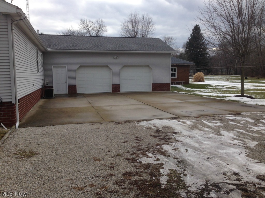 101 Morges Road Malvern, OH 44644 - Photo 4 of 18 Large 2+ car garage and large concrete drive