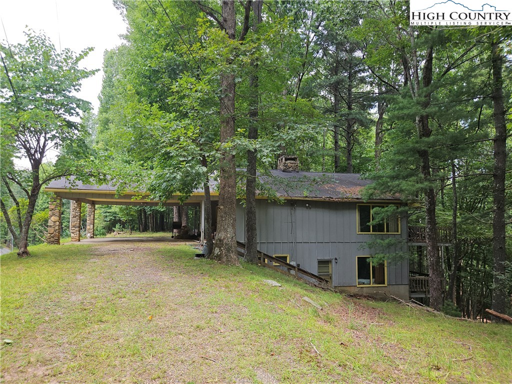 1783 Powder Horn Mountain Road Deep Gap, NC 28618 - Photo 2 of 7 a front view of house with yard and trees around