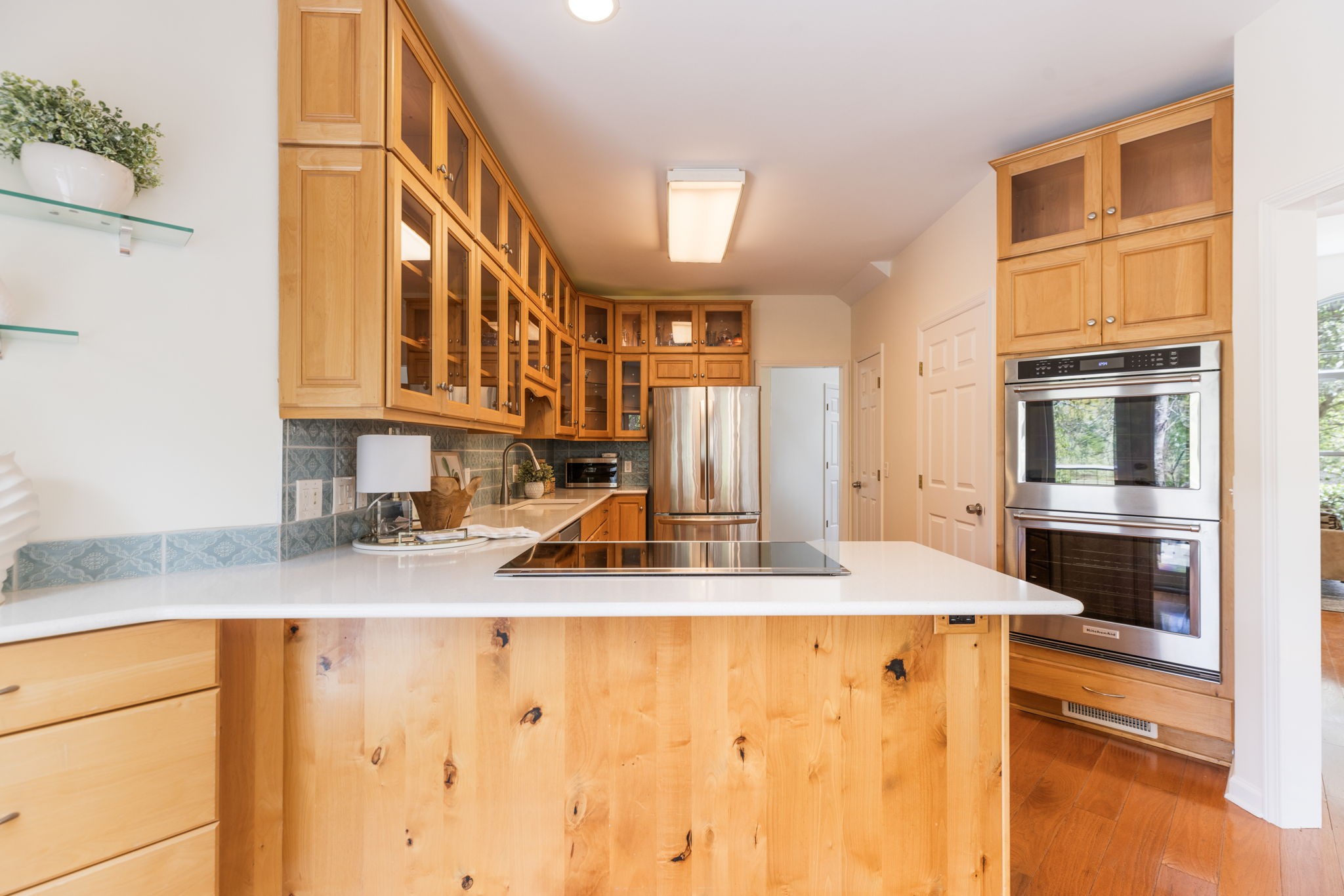 8013 Boone Trace Nashville, TN 37221 - Photo 13 of 34 a kitchen with granite countertop a sink a stove and cabinets