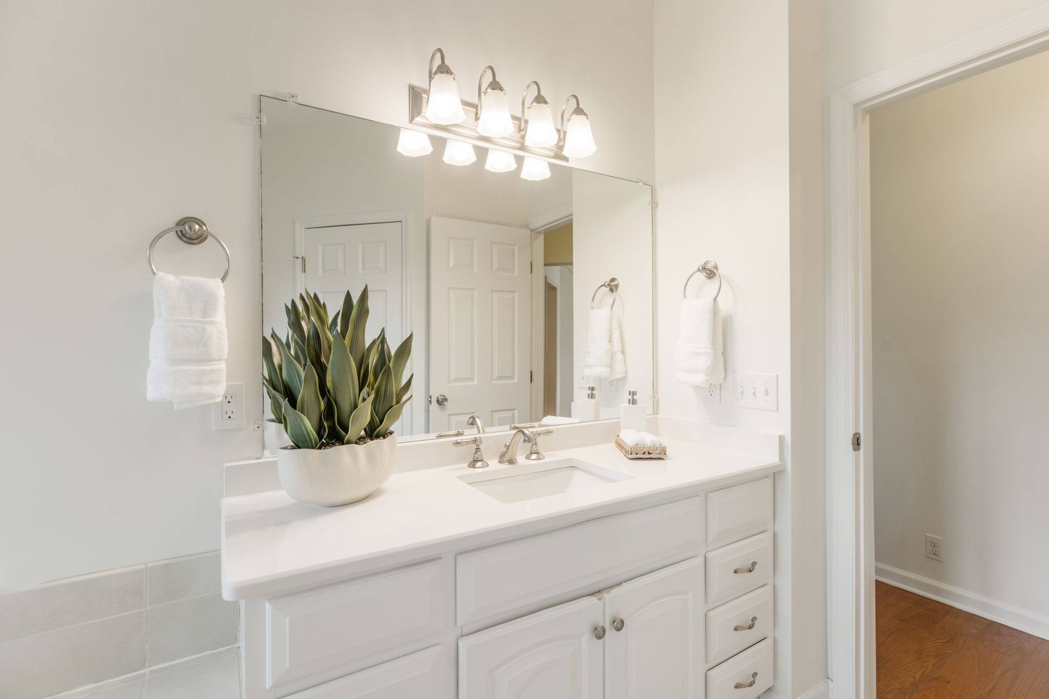 8013 Boone Trace Nashville, TN 37221 - Photo 20 of 34 a bathroom with a sink double vanity and a mirror
