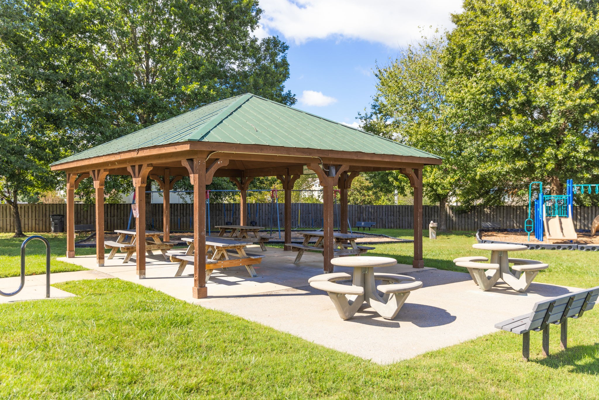 8013 Boone Trace Nashville, TN 37221 - Photo 33 of 34 a view of a swimming pool with a table and chairs under an umbrella