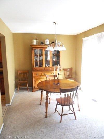 76 Stratford Lane, Unit 17 Rochester, MI 48309 - Photo 6 of 21 Dining room w/doowall to deck