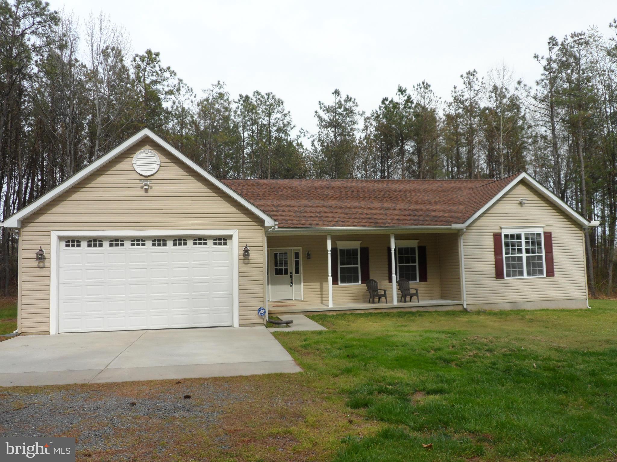 7409 Rixey Road King George, VA 22485 - Photo 2 of 18 Concrete pad in front of the garage.