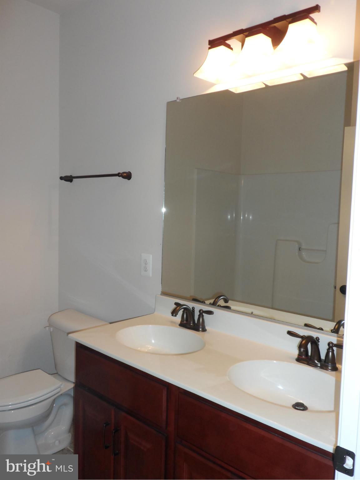 7409 Rixey Road King George, VA 22485 - Photo 15 of 18 Hall Bath with tile floor.