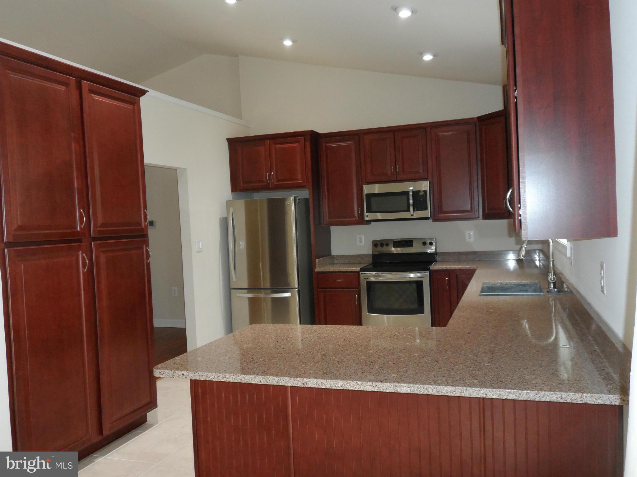 7409 Rixey Road King George, VA 22485 - Photo 7 of 18 Loads of cabinets and quart counter tops!