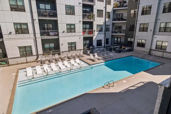 a view of a building with balcony and seating space