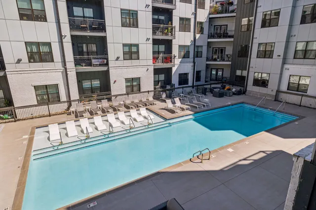 a view of a building with balcony and seating space
