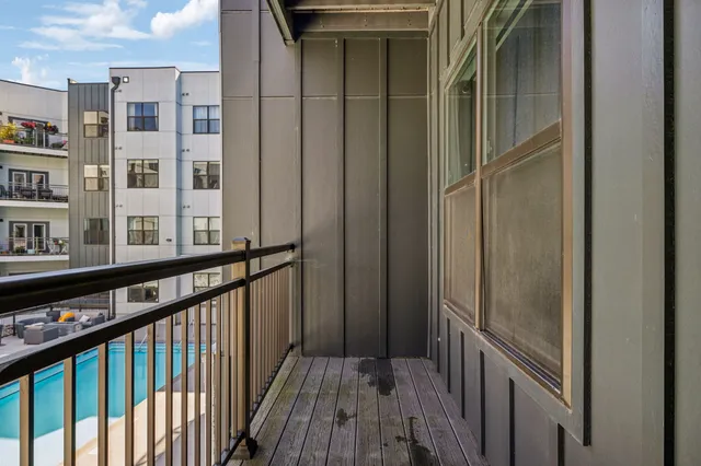 a view of balcony with wooden floor