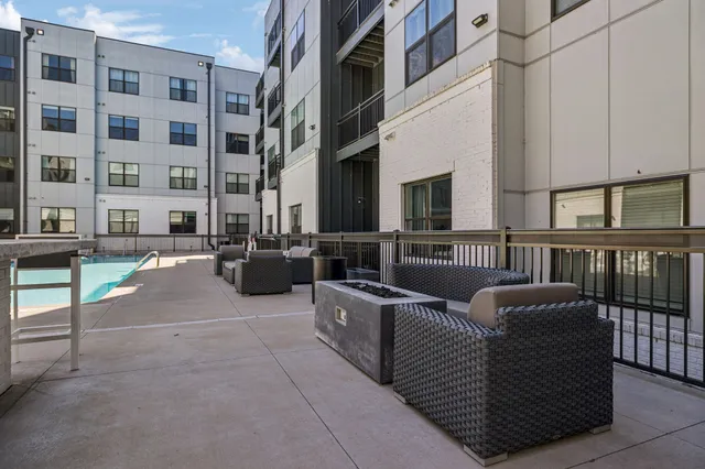 a view of a building with outdoor seating