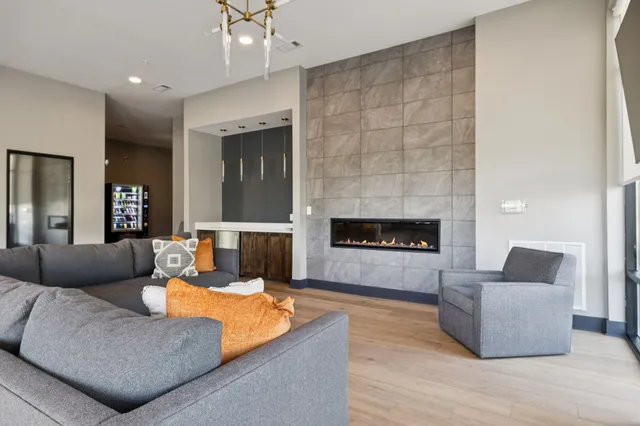 a living room with furniture and a fireplace