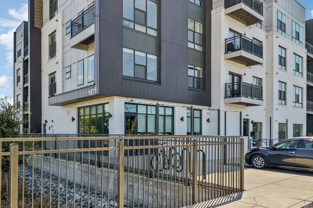 a view of a brick building from a balcony
