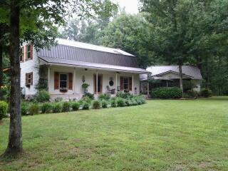 7282 Kingston Road Fairview, TN 37062 - Photo 1 of 20 a front view of a house with garden
