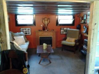 7282 Kingston Road Fairview, TN 37062 - Photo 18 of 20 a living room with furniture and a fireplace