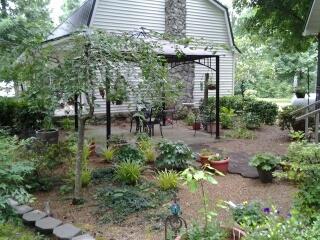 7282 Kingston Road Fairview, TN 37062 - Photo 4 of 20 a view of backyard with plants and outdoor seating