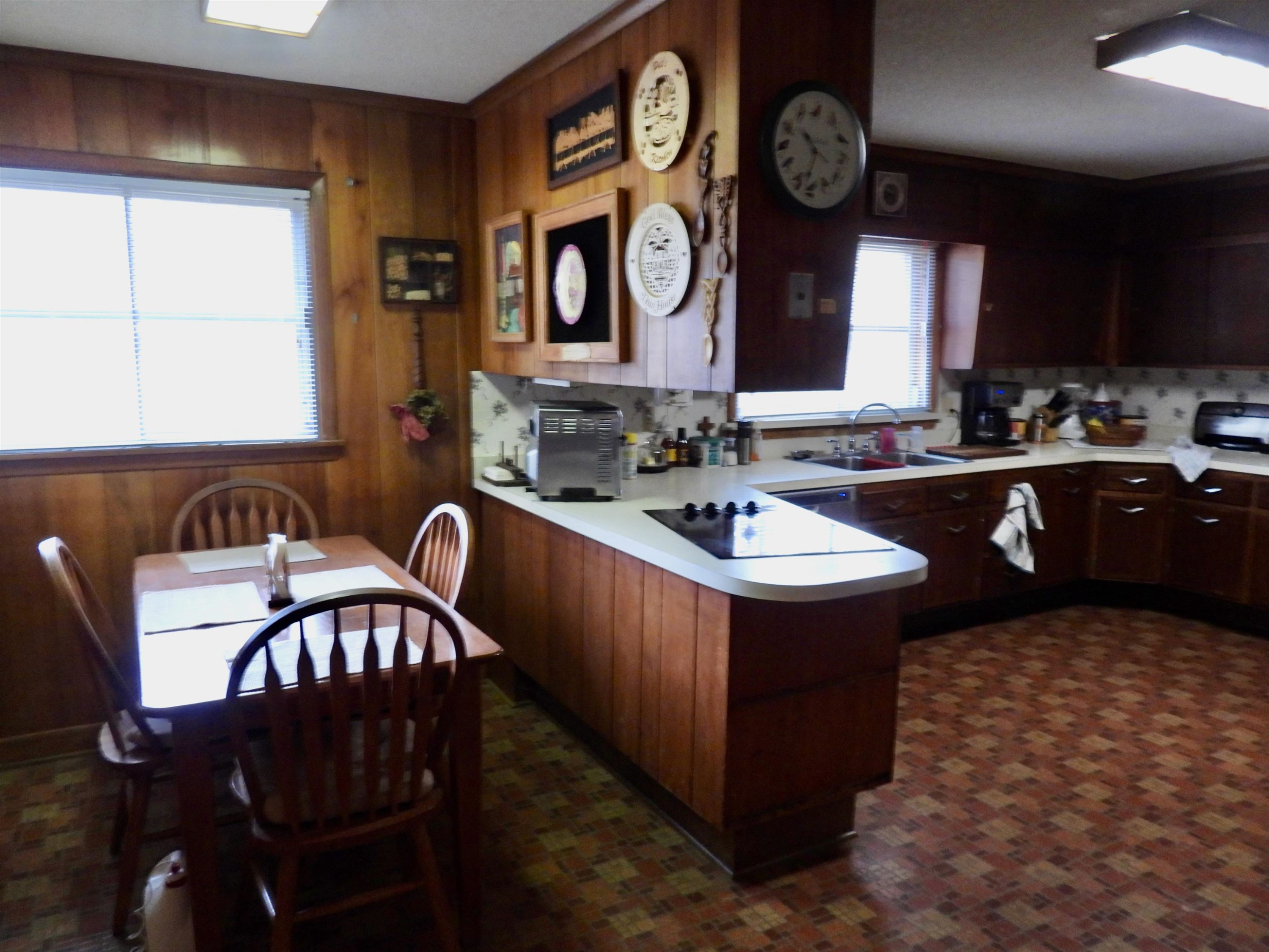 3007 Old Raleigh Road Apex, NC 27502 - Photo 11 of 39 a kitchen with a stove a sink and a dining table