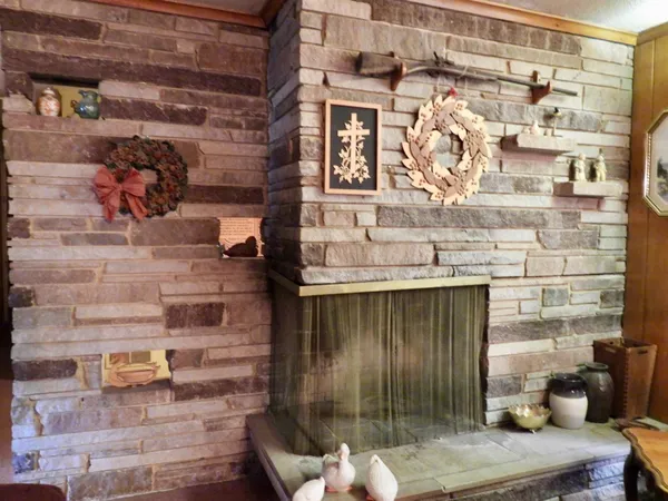 a living room with furniture and large windows