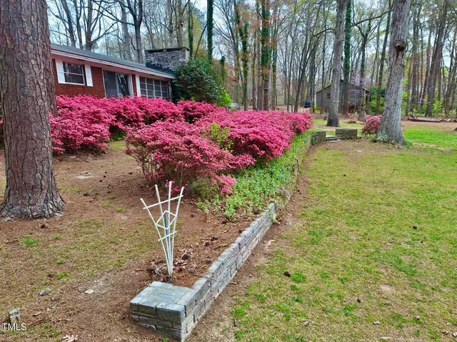 a front view of a building with garden