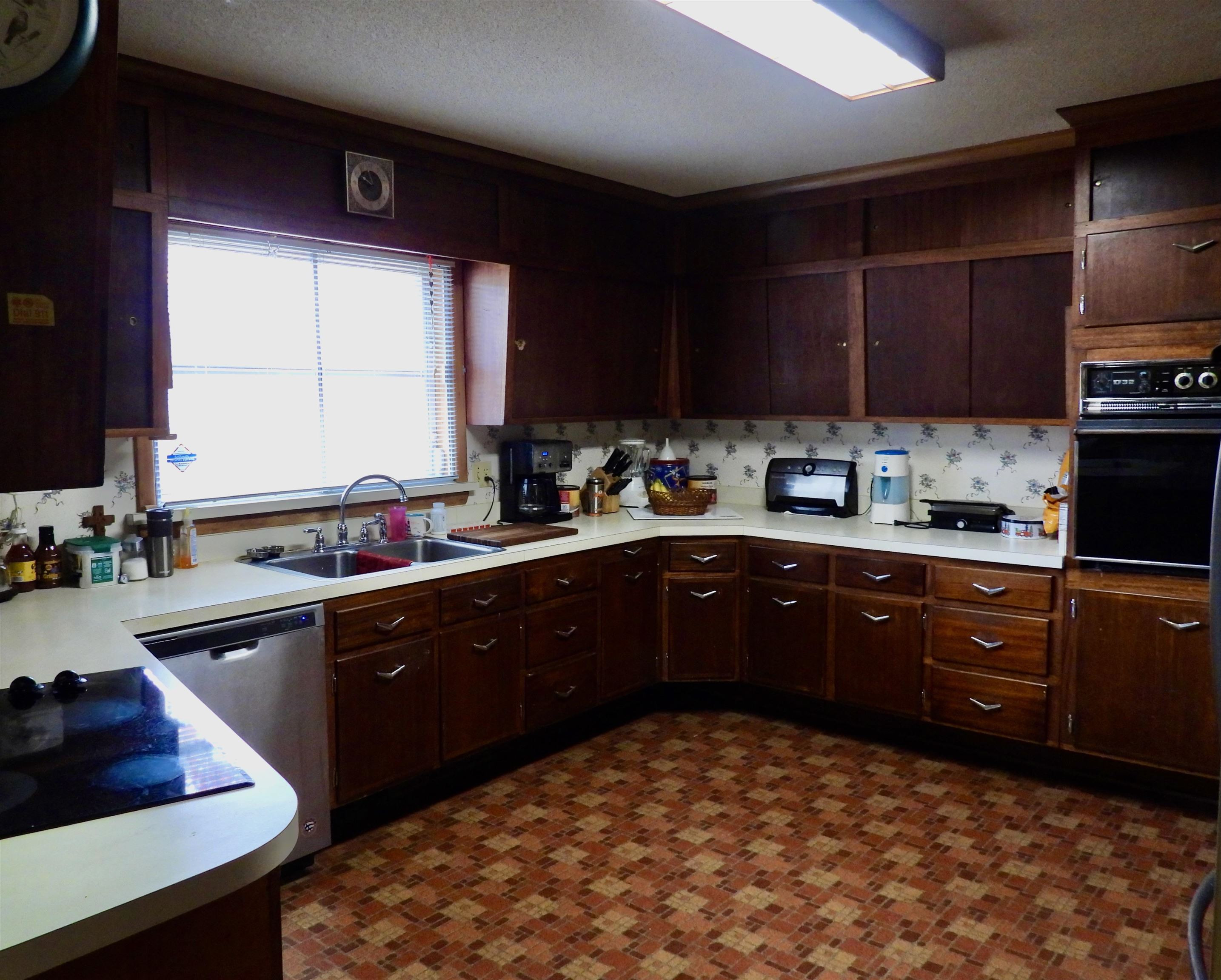 3007 Old Raleigh Road Apex, NC 27502 - Photo 17 of 39 a kitchen with a sink cabinets and window