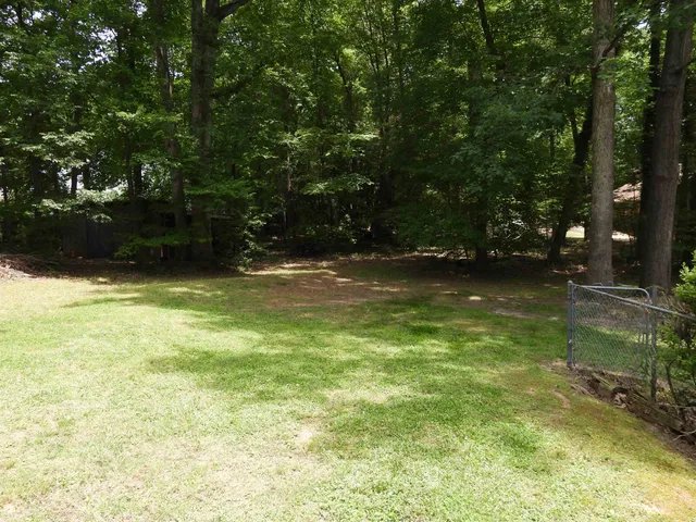 a view of a building with a swimming pool outdoor seating