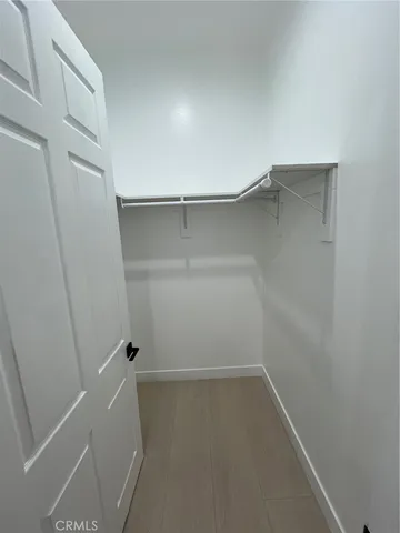a view of an empty walk in closet