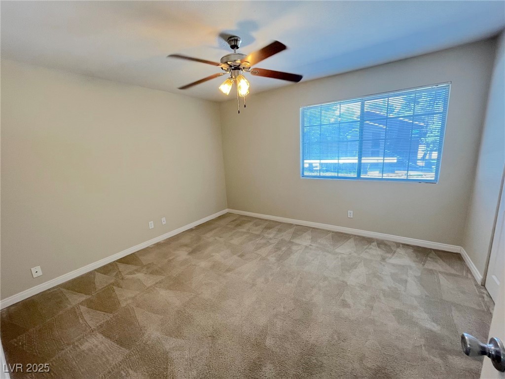 2750 South Durango Drive, Unit 2139 Las Vegas, NV 89117 - Photo 14 of 21 Unfurnished room featuring light carpet and ceiling fan