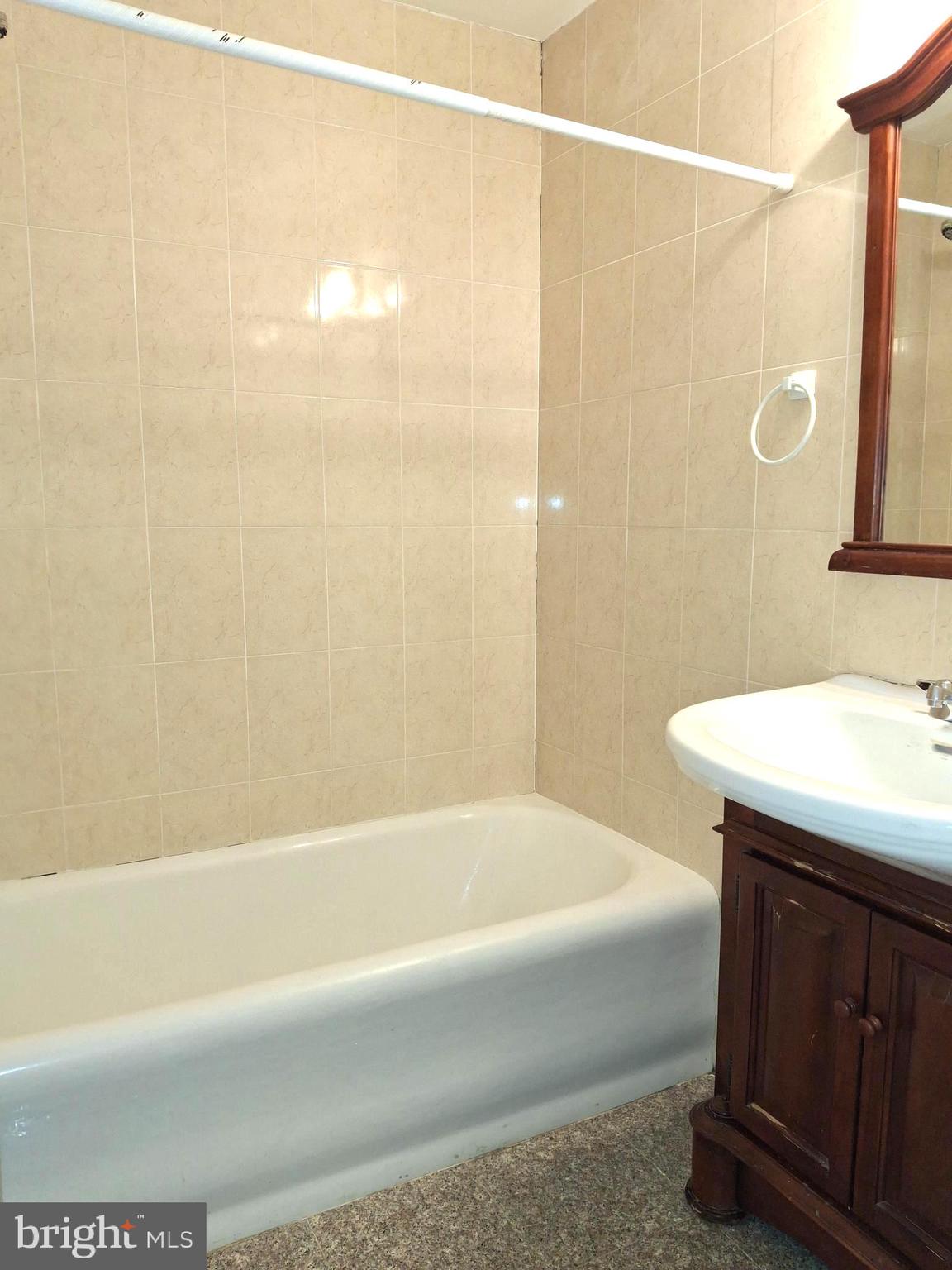 1324 Locust Street, Unit 1421 Philadelphia, PA 19107 - Photo 3 of 15 a bathroom with a sink and a bathtub