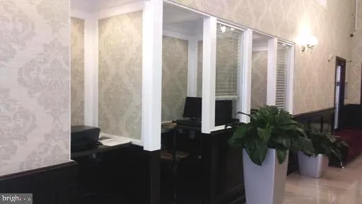 a potted plant sitting in front of a bathroom