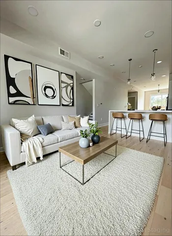 a living room with furniture and a table