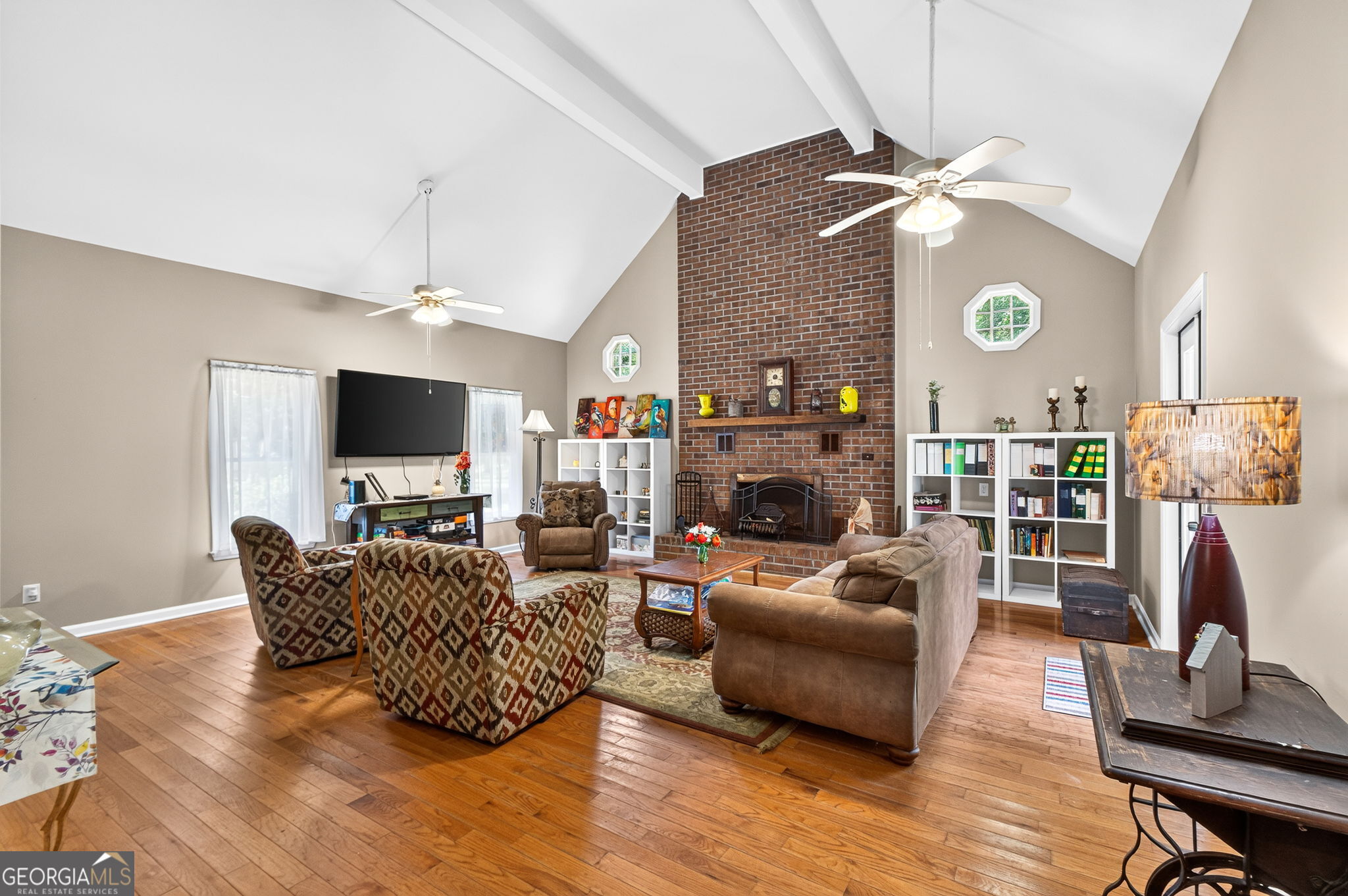 169 Silver Dollar Road Barnesville, GA 30204 - Photo 23 of 66 Large floor to ceiling fireplace brick, high ceilings doors to side entrance and to back patio