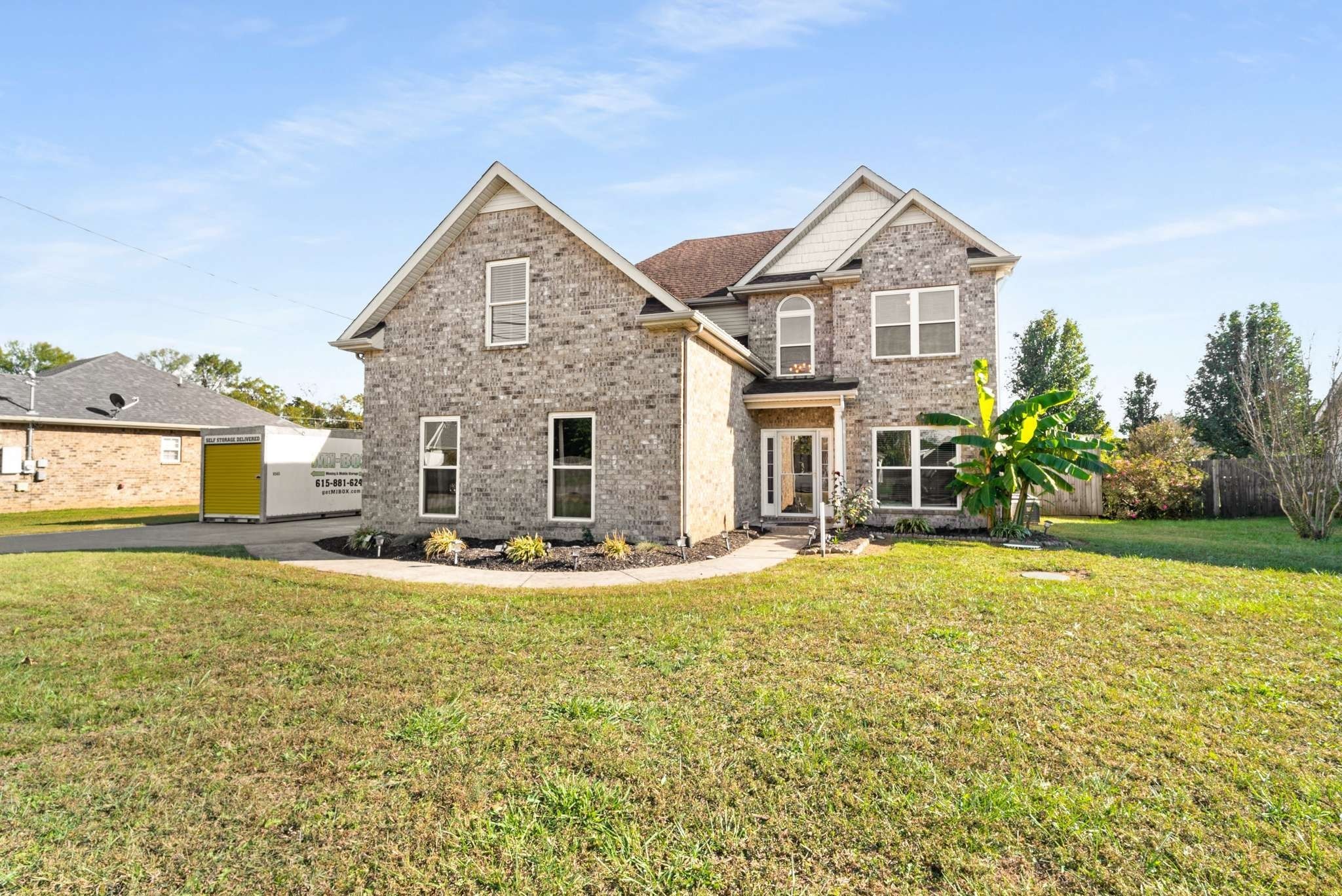1105 Mantle Way Murfreesboro, TN 37129 - Photo 2 of 47 a view of a house with a yard and garage