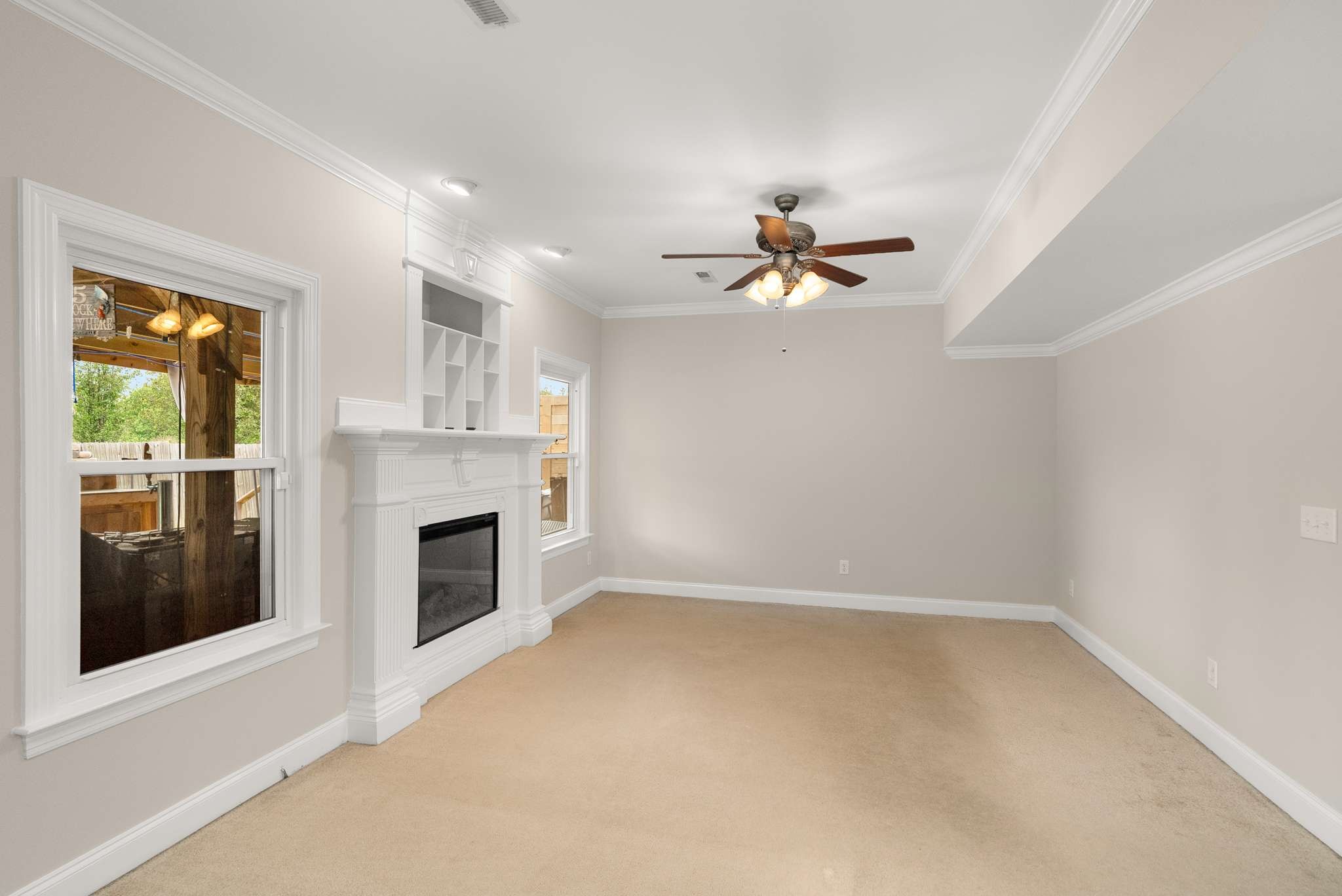 1105 Mantle Way Murfreesboro, TN 37129 - Photo 24 of 47 an empty room with fireplace ceiling fan and windows