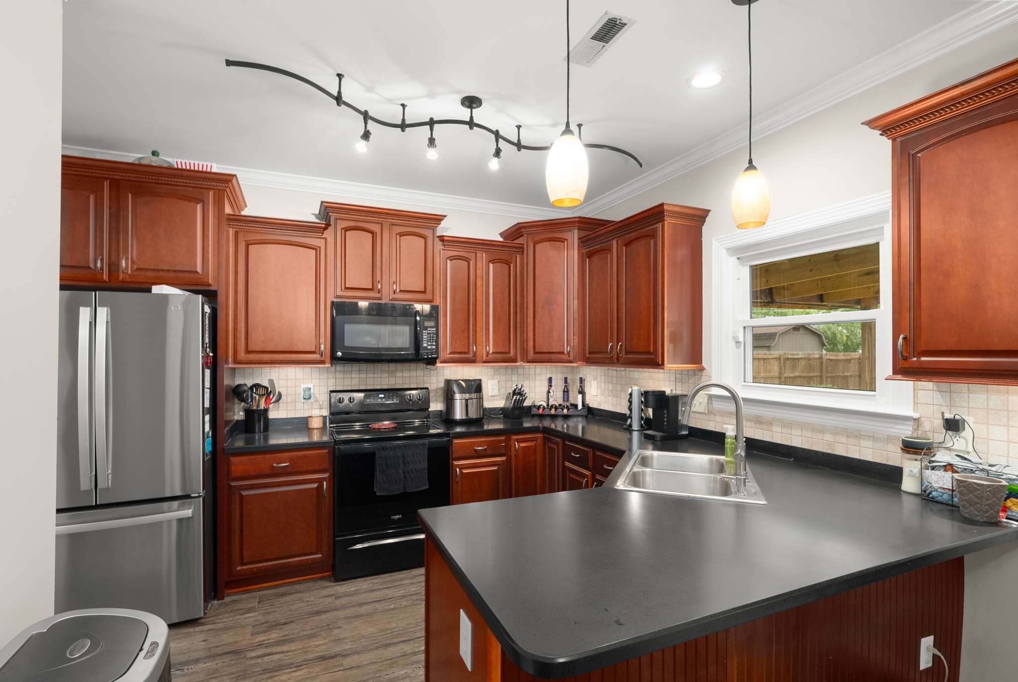 1105 Mantle Way Murfreesboro, TN 37129 - Photo 27 of 47 a kitchen with stainless steel appliances granite countertop a sink a stove and refrigerator