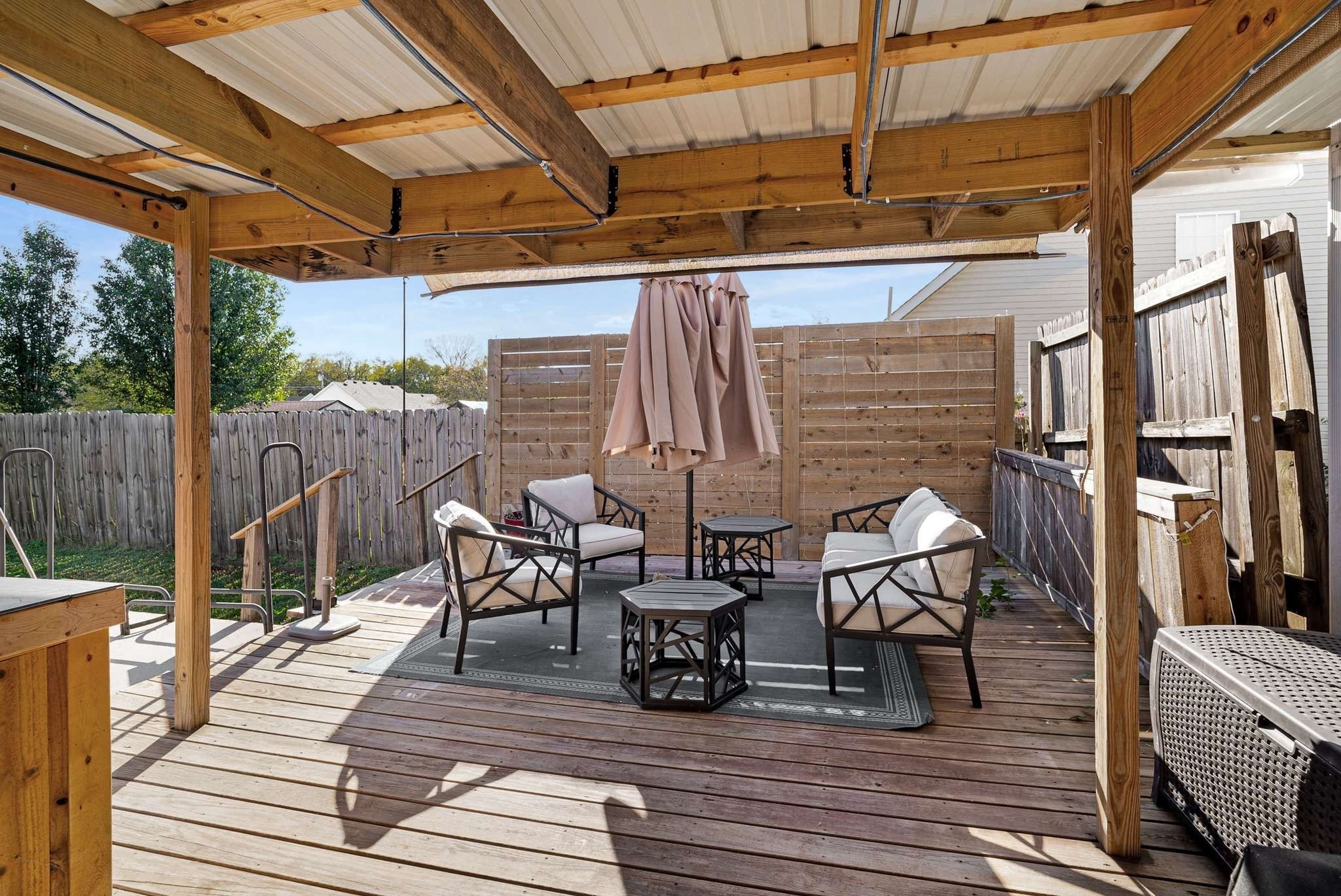 1105 Mantle Way Murfreesboro, TN 37129 - Photo 9 of 47 a view of a roof deck with table and chairs with wooden floor and fence