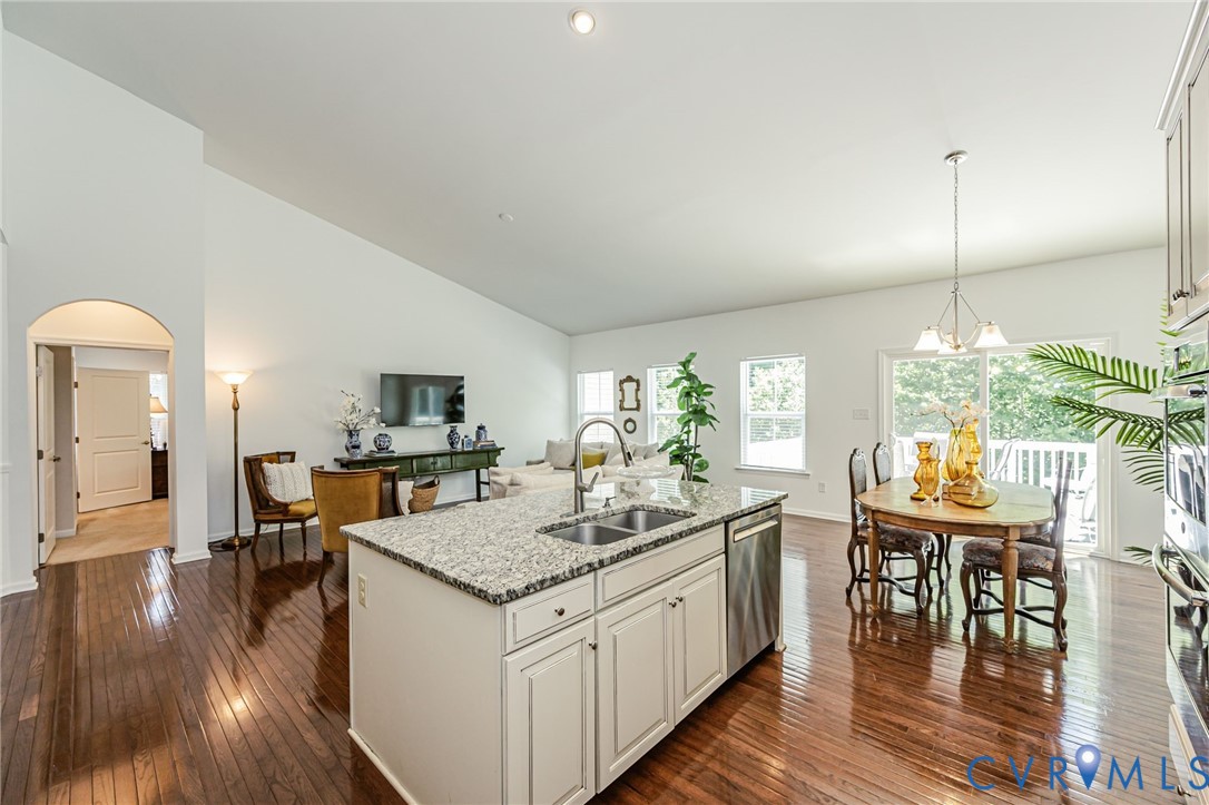 7435 Wicks Road Williamsburg, VA 23188 - Photo 33 of 82 Kitchen island featuring a double-basin sink and s