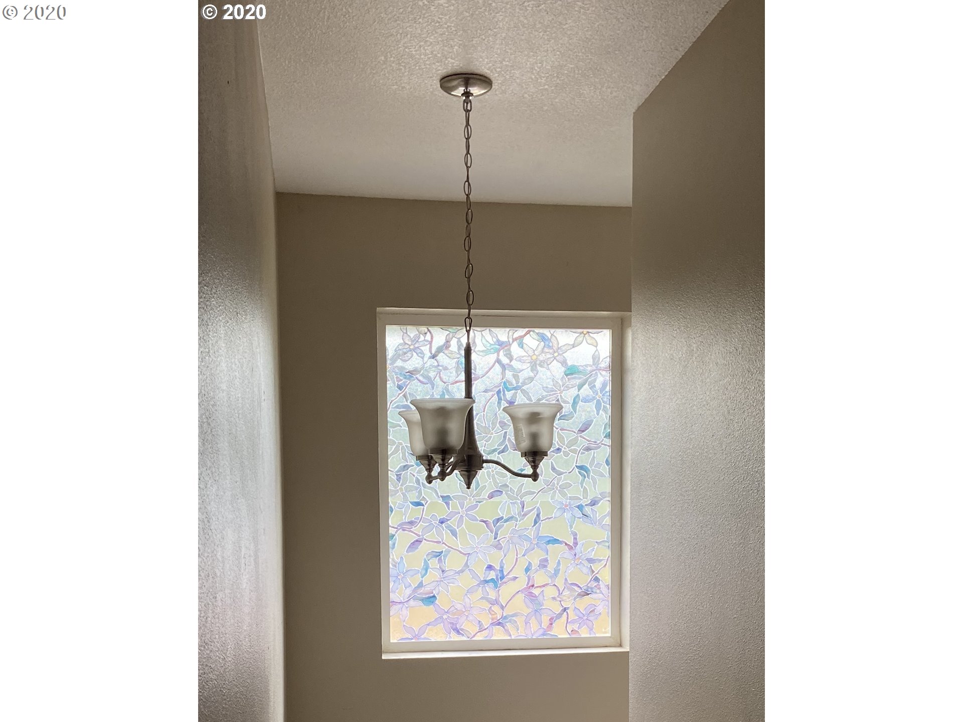 1998 Pruner Road Riddle, OR 97469 - Photo 8 of 22 a view of a hallway with a chandelier