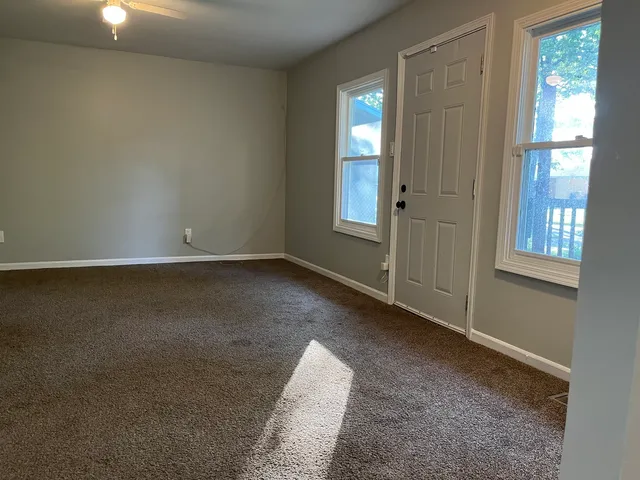 an empty room with windows