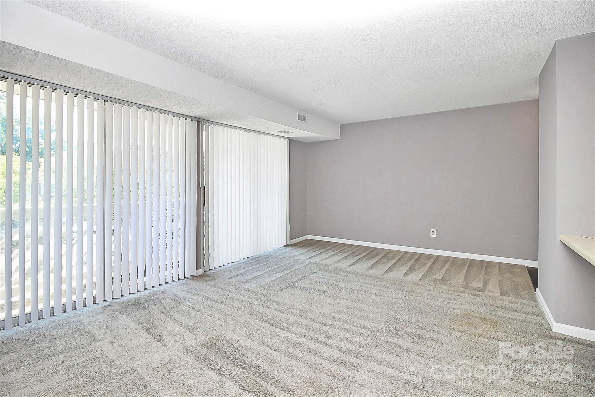9409 Old Concord Road, Unit M Charlotte, NC 28213 - Photo 14 of 29 a view of an empty room with a window