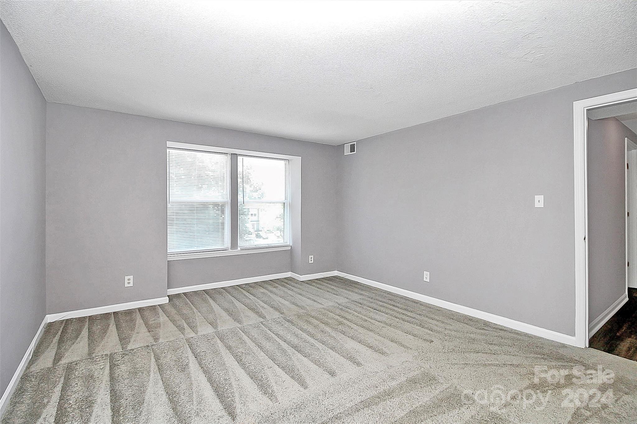 9409 Old Concord Road, Unit M Charlotte, NC 28213 - Photo 18 of 29 a view of an empty room with a window