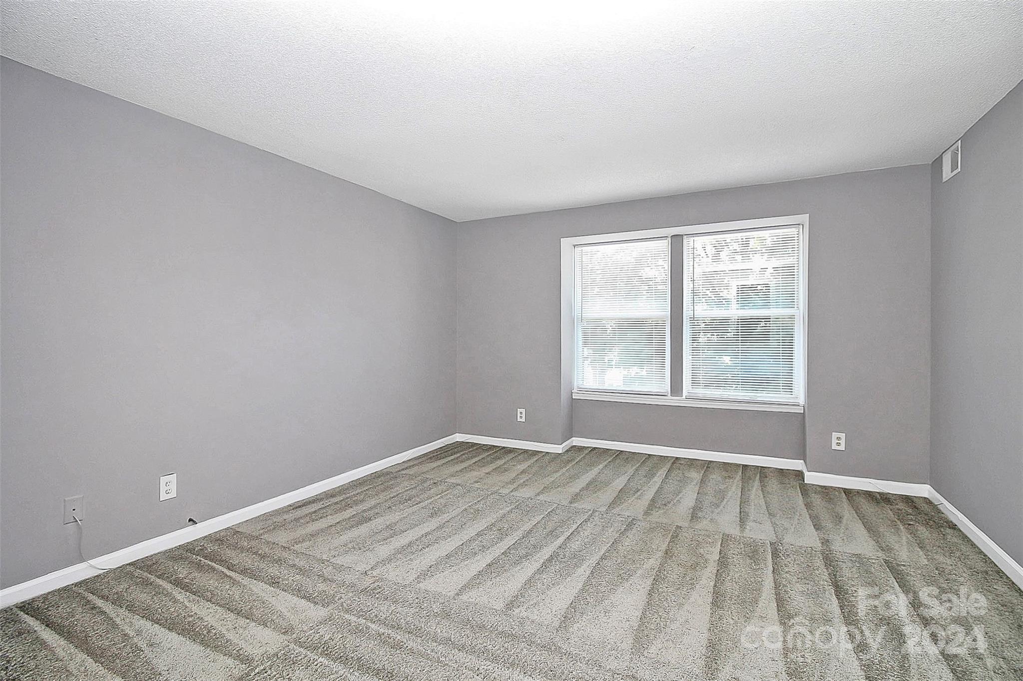9409 Old Concord Road, Unit M Charlotte, NC 28213 - Photo 19 of 29 a view of an empty room with a window