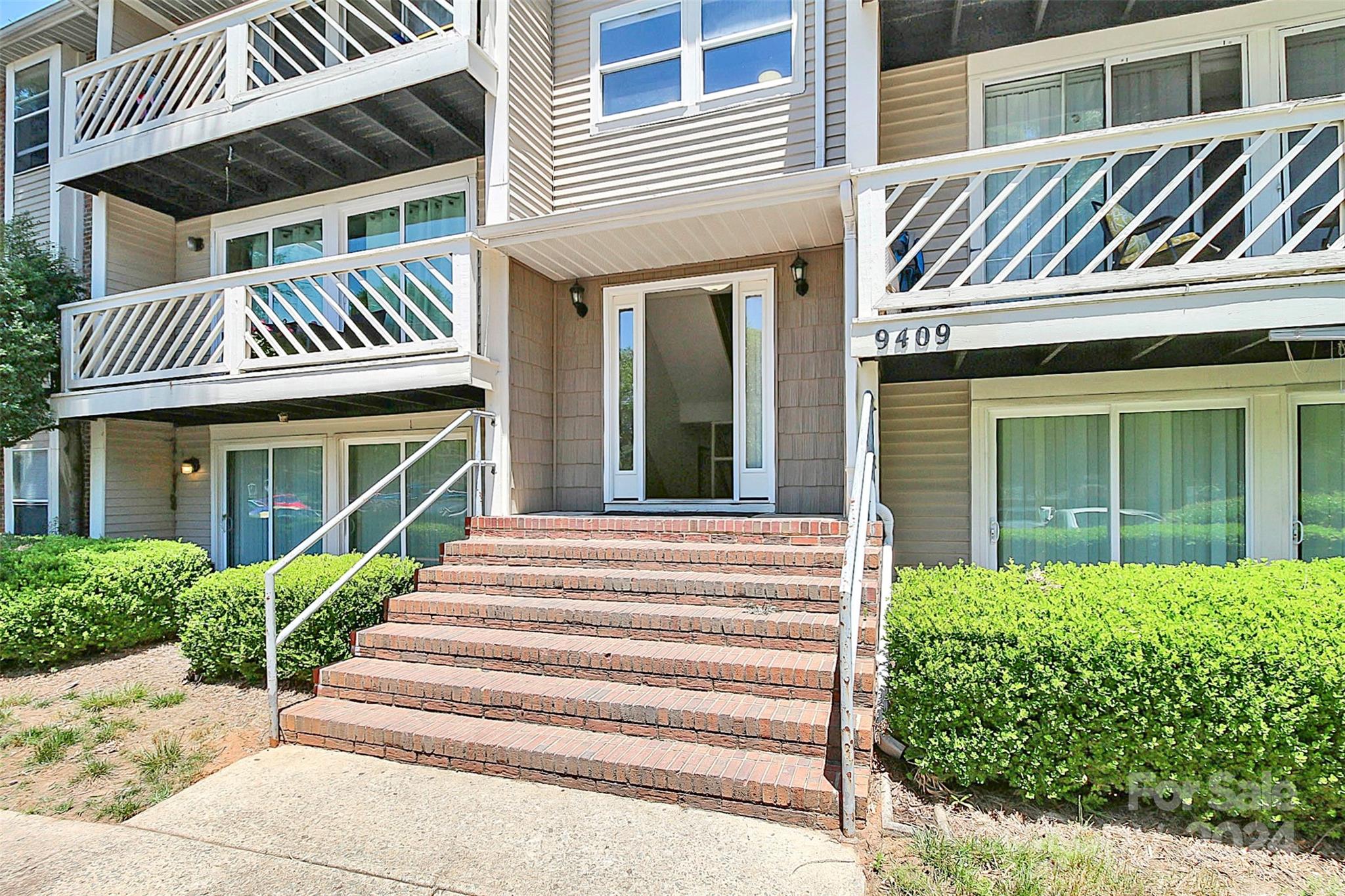 9409 Old Concord Road, Unit M Charlotte, NC 28213 - Photo 2 of 29 a view of a house with a window and stairs